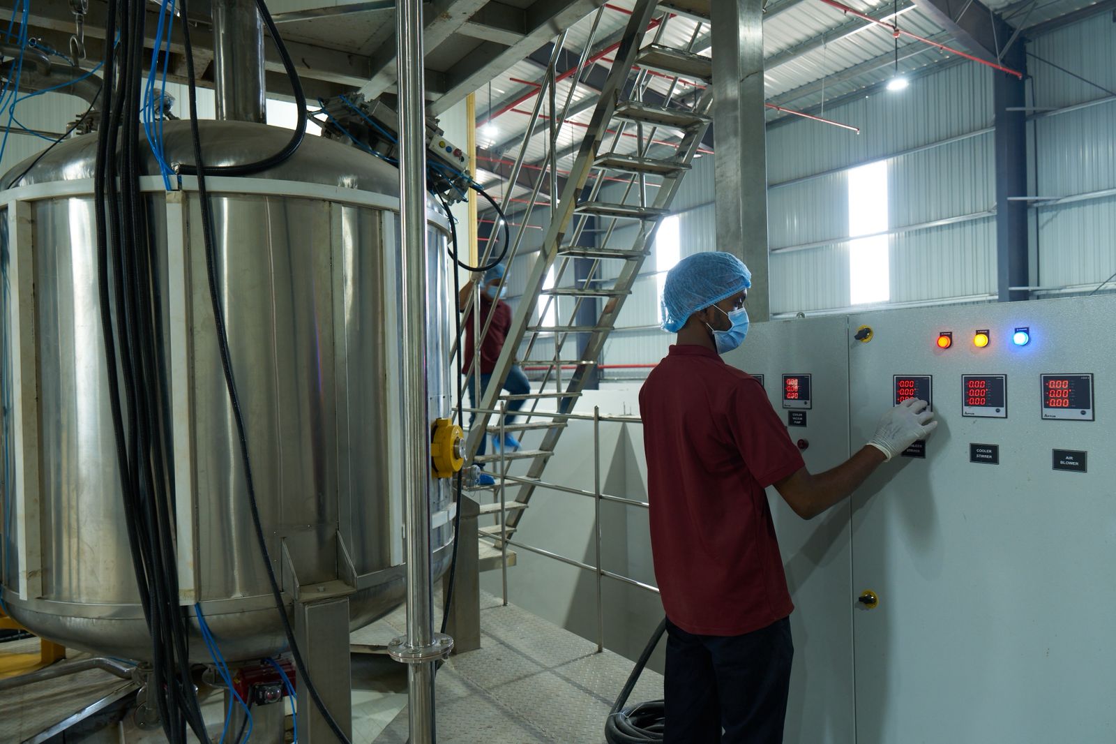 Operator monitoring process controls in a commercial manufacturing environment.